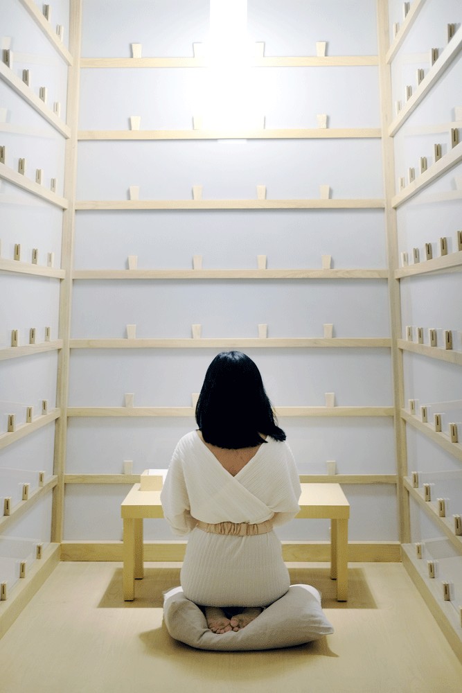 A letter to my grandma: A visitor writes a letter inside a booth of Lee Mingwei’s The Letter Writing Project. The installation is rooted in his routine of writing letters to his deceased grandmother over the course of one-and-a-half years. 