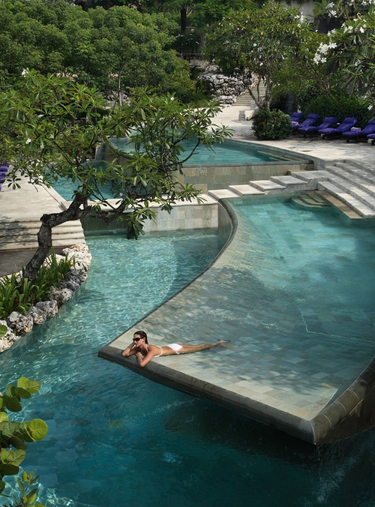 A guest in the River Pool of Ayana Resort & Spa Bali