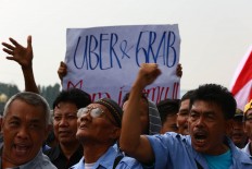 Taxi protest turns violent as drivers target other drivers