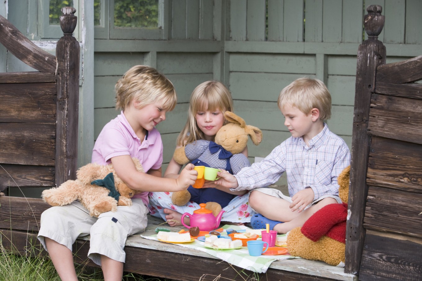 child playing with dolls