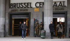 ommuters walk past soldiers on duty at Brussels Central Station as they return to work after the easter holidays in Brussels, Tuesday, March, 29, 2016. The mayor of Brussels, holding special meetings in Paris after deadly attacks on his city, says the European Union's capital can never go back to "normal" again.  Yvan Mayeur met with Paris Mayor Anne Hidalgo in the French capital's neo-Renaissance city hall Tuesday for discussions on how Paris reacted to the November attacks.