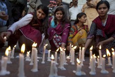 Members of a civil society group light candles during a vigil for the victims of Sunday's suicide bombing, Monday, March 28, 2016 in Karachi, Pakistan. Pakistan's prime minister vowed to eliminate perpetrators of terror attacks such as the massive suicide bombing that targeted Christians gathered for Easter the previous day in the eastern city of Lahore, killing tens of people. 