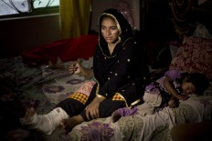Affafa, who lost her parents and a sister in a bombing and another sister and brother badly injured, sits in a room in Lahore, Pakistan, Monday, March 28, 2016. Pakistan's prime minister on Monday vowed to eliminate perpetrators of terror attacks such as the massive suicide bombing that targeted Christians gathered for Easter the previous day in the eastern city of Lahore, killing 70 people. AP/B.K. Bangash