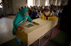 The grandmother of Pakistani Christian boy Sahil Pervez, mourns his death, at a church in Lahore, Pakistan, Monday, March 28, 2016. The death toll from a massive suicide bombing targeting Christians gathered on Easter in the eastern Pakistani city of Lahore rose on Monday as the country started observing a three-day mourning period following the attack. AP/B.K. Bangash