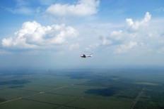 Plane crashes into homes in Papua