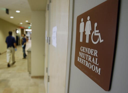 A sign marks the entrance to a gender-neutral restroom at the University of Vermont in Burlington, Vt., Aug. 23, 2007.