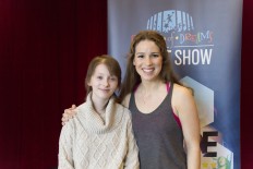 In this March 17, 2016 released by Madison Square Garden, 13-year-old brain cancer survivor Hannah Pienkowski, left, poses with Chilina Kennedy, who plays Carole King on Broadway in “Beautiful: The Carole King Musical,” in New York. Kennedy helped Hannah prepare a King song for the upcoming annual Garden of Dreams talent show. 
