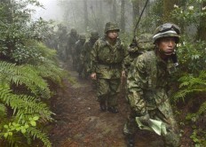 Members of the Japan Self-Defense Forces resume a search operation for a disapeared Japanese military jet carrying six airmen, in Kanoya city, Kagoshima prefecture, southern Japan, Thursday.