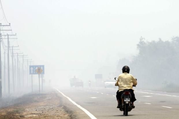 Haze from forest fires in Kalimantan, Indonesia blankets Papar district, in Sabah, Malaysia.