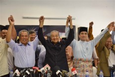 Malaysia police open four investigations on Mahathir