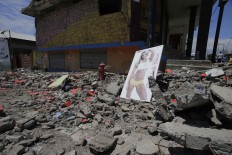 A destroyed house is seen in Pedernales, Ecuador, Sunday, April 17, 2016. A magnitude-7.8 quake, the strongest since 1979, hit Ecuador flattening buildings, buckling highways along its Pacific coast and killing hundreds. AP Photo/Dolores Ochoa
