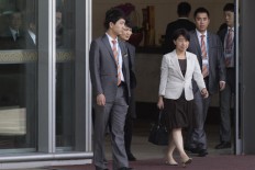 Taiwan officials: Fraud suspects deported to China seem well