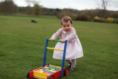 In this undated handout photo released on Sunday, May 1, 2016 by Kensington Palace, Britain's Princess Charlotte poses for a photograph, at Anmer Hall, in Norfolk, England. The princess will celebrate her first birthday on Monday. 