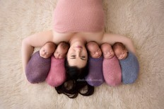 Kim Tucci, 26, with her quintuplets Keith, Ali, Penelope, Tiffany and Beatrix. 