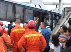 Train hits Transjakarta bus, car at rail crossing