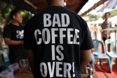 A barista wears a t-shirt that reads ‘Bad Coffee Is Over’, as part of a campaign promoting Indonesia as home to some of the best quality coffee in the world. JP/ Hotli Simanjuntak