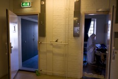 In this Wednesday, April 20, 2016 photo, Iraqi refugee Fatima Hussein, 65, prays inside her room at the former prison of De Koepel in Haarlem, Netherlands. With crime declining in the Netherlands, the country is looking at new ways to fill its prisons. AP Photo/Muhammed Muheisen
