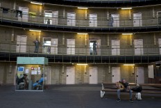In this Thursday, April 21, 2016 photo, Syrian refugee Fadi Tahhan, 23, right, sings while playing Oud at the former prison of De Koepel in Haarlem, Netherlands. With crime declining in the Netherlands, the country is looking at new ways to fill its prisons.  AP Photo/Muhammed Muheisen