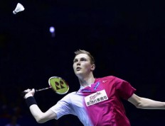 Viktor Axelsen of Denmark prepares to return a shot against Tommy Sugiarto of Indonesia in their men's singles final group match in the Thomas Cup in Kunshan in east China's Jiangsu province on Sunday, May 22, 2016.