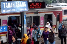 Commuters wait for trains at Tanah Abang station, on March 10, 2016. JP/Seto Wardhana