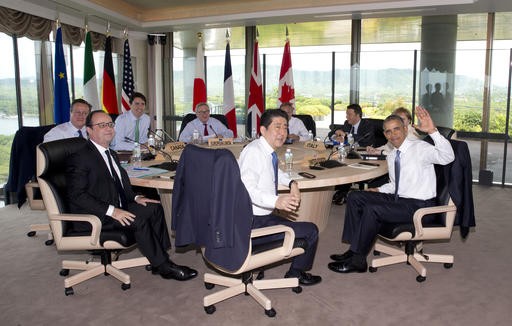 Leaders of Group of Seven nations (from left) British Prime Minister David Cameron, French President Francois Hollande, Canadian Prime Minister Justin Trudeau, European Commission President Jean-Claude Juncker, Japanese Prime Minister Shinzo Abe, European Council President Donald Tusk, Italian Prime Minister Matteo Renzi, US President Barack Obama and German Chancellor Angela Merkel look to media as they gather to participate in a G-7 Working Session in Shima, Japan, Friday,  during the G-7 Summit.