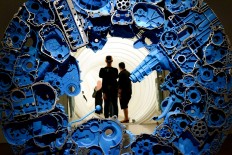 A futuristic artwork composed of machine parts leads people to another dimension at ARTJOG 2016.