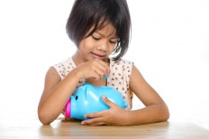 Teaching children about money may take a lifetime, so it's better to start the lesson as early as possible.