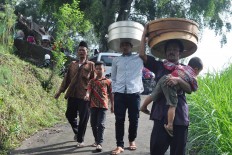After the ritual, the residents head home and some pay a visit to their neighbors. The Jakarta Post/ Albertus Magnus Kus Hendratmo