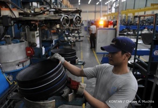 A worker inspects a newly manufactured tire at Multistrada Arah Sarana's factory in this 2016 photo.