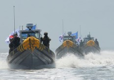 China says Indonesian navy shot at Chinese fishermen 