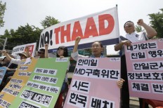 SKorea military: NKorea fires 2 suspected midrange missiles 