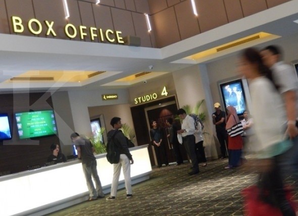 Moviegoers are seen at XXI cinema in Jakarta.