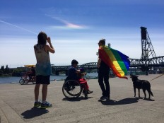 People photograph a rainbow-colored cloud that appeared over the Willamette River during the Gay Pride Parade and Festival in Portland, Ore., Sunday, June 19, 2016. The unusual cloud delighted parade-goers celebrating in Tom McCall Waterfront Park. AP Photo/Gillian Flaccus

