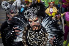 A transvestite known as Salvatore marches in the 16th annual gay pride parade to mark the upcoming International Gay Pride Day, and to honor the victims of the Orlando nightclub shooting, in Santiago, Chile, Saturday, June 25, 2016. Marchers are also demanding laws in favor of same sex marriage and gender identity. AP Photo/Esteban Felix
