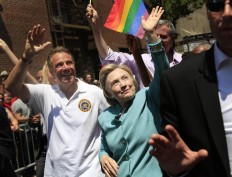 Democratic presidential candidate Hillary Clinton, center, marches with New York Gov. Andrew Cuomo, left, in the New York City Pride Parade in New York, Sunday, June 26, 2016. AP Photo/Seth Wenig
