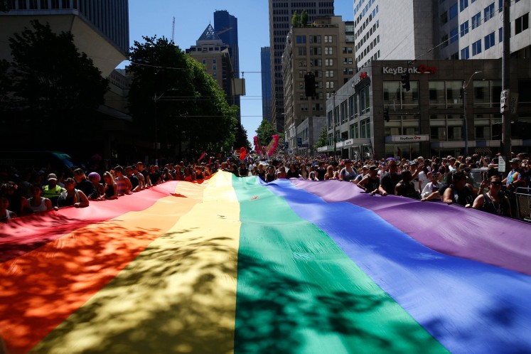 Rainbow flags, images of shooting victims at pride parades 