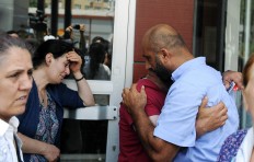 Family members of victims cry outside the Bakirkoy State Hospital in Istanbul, Wednesday, June 29, 2016. AP Photo/Omer Kuscu
