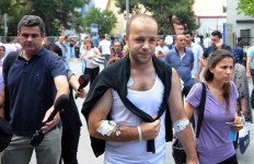 An injured man leaves Bakirkoy State Hospital in Istanbul, Wednesday, June 29, 2016. AP Photo/Omer Kuscu