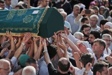 Mourners carry the coffin of Muhammed Eymen Demirci, killed Tuesday at the blasts in Istanbul's Ataturk airport, during the funeral in Istanbul's Basaksehir neighborhood, Wednesday, June 29, 2016. Demirci was 25 years old and worked for ground services at the airport. AP Photo/Lefteris Pitarakis