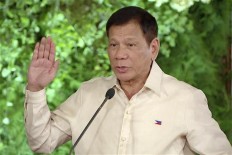 Hope and fear as combative president takes over Philippines 