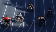 In this Friday, July 1, 2016 photo, women compete in a 100-meter dash final during the U.S. Paralympics Team Trials in Charlotte, N.C. AP Photo/Chuck Burton