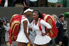 Venus and Serena back in Wimbledon quarterfinals 