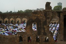 Indian Muslims offer Eid al-Fitr prayers at the 14th century Ferozeshah Kotla Jami Mosque in New Delhi, India, Thursday, July 7, 2016. Eid al-Fitr marks the end of the Muslim holy fasting month of Ramadan. AP Photo/Manish Swarup