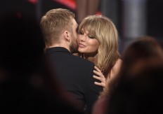 Swift says she co-wrote ex's latest hit; Harris lashes out