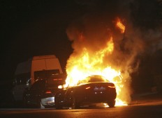 A car burns during firefight between Turkish army and Turkish police, in Istanbul's Taksim square, early Saturday, July 16, 2016. Members of Turkey's armed forces said they had taken control of the country, but Turkish officials said the coup attempt had been repelled early Saturday morning in a night of violence, according to state-run media. AP Photo/Cavit Ozgul