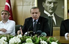 In this image taken from video provided by Anadolu Agency, Turkish President Recep Tayyip Erdogan speaks to the media Saturday, July 16, 2016 in Istanbul. Erdogan said that his government was working to crush a coup attempt after a night of explosions, air battles and gunfire that left dozens dead and at least 150 people wounded. Anadolu Agency via AP
