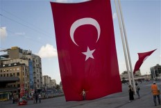 Turkey fires tens of thousands in coup plotters hunt 