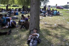 Protesting migrants ask EU leaders why borders are closed