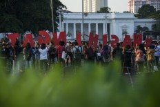 Jokowi's second year: Human rights and security reform questioned