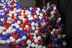 Secret Service agents stand in the balloons as they guard the backstage entrance at the end of the final day of the Democratic National Convention, Friday, July 29, 2016, in Philadelphia. AP Photo/Mary Altaffer
